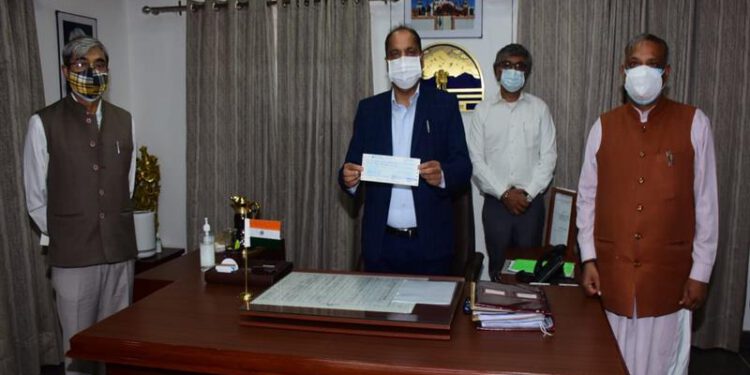 Sukh Ram Chaudhary presents cheque of Rs. 3.11 crore to Chief Minister