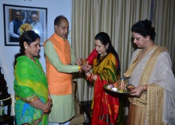 BJP Mahila Morcha members tie Rakhi on wrist of CM
