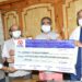 Industries Minister Presents Cheques to Chief Minister