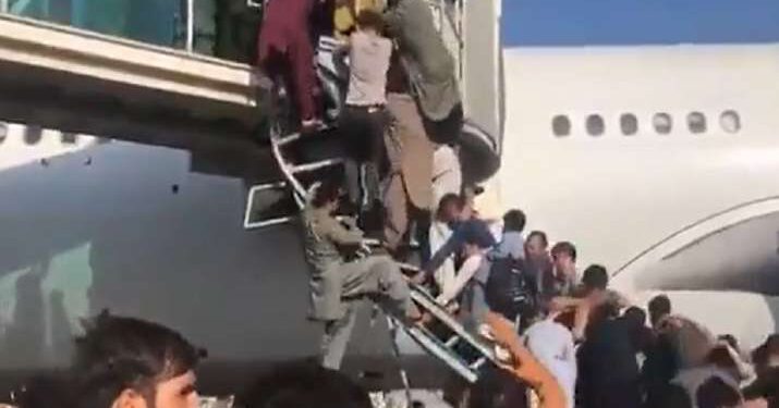 Desperate scenes at Kabul airport as hundreds push each other to board plane to fly out of Afghanistan; 5 dead