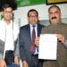 Chairman of Himalayan Group of professional institutions Rajneesh Bansal presented a cheque of Rs 1.51 lakh to Chief Minister